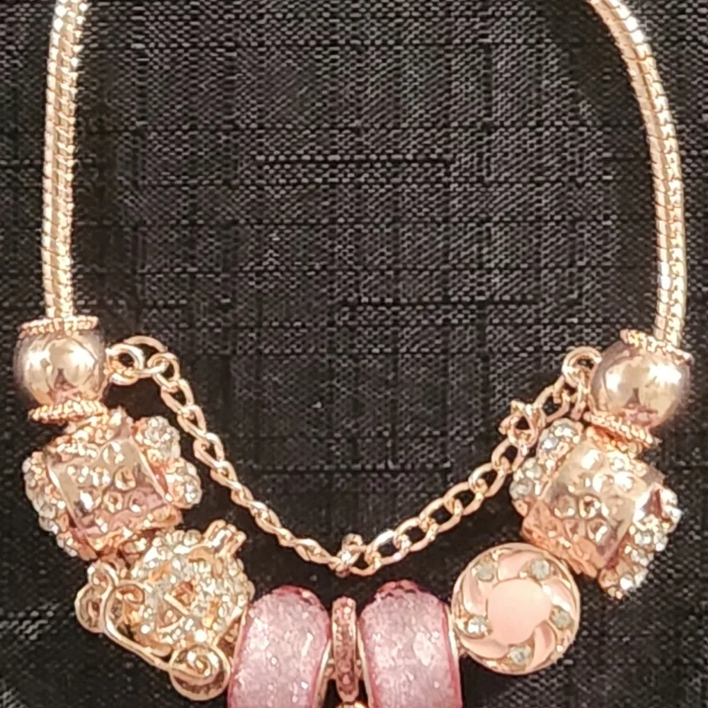 Gold and Pink Charm Bracelet with Ornate Charms. ITEM No. 19-144